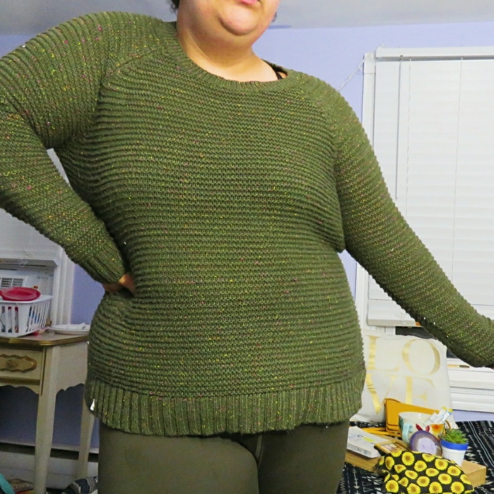 A green sweater